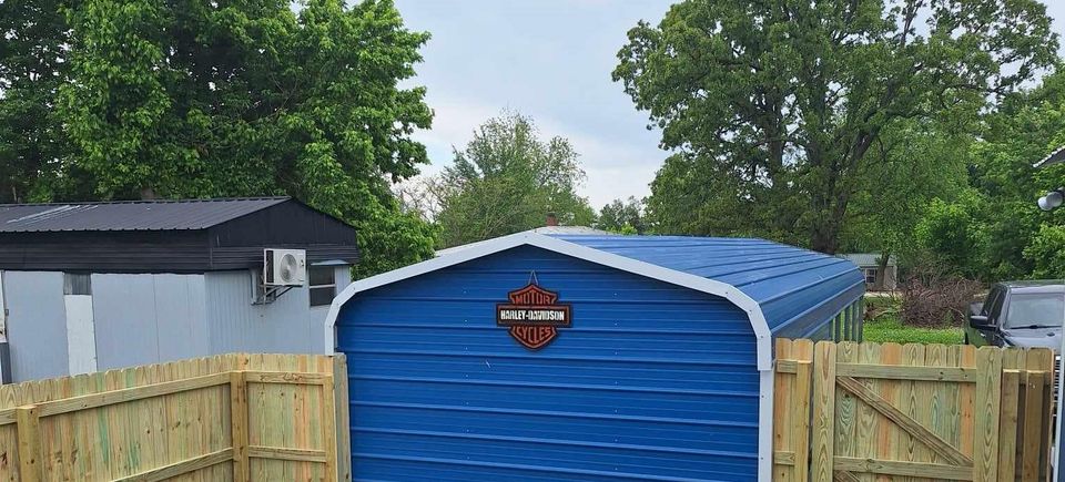 Privacy fence around blue shed