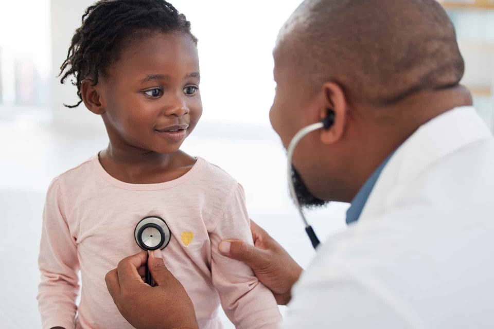 Doctor consulting with a young patient