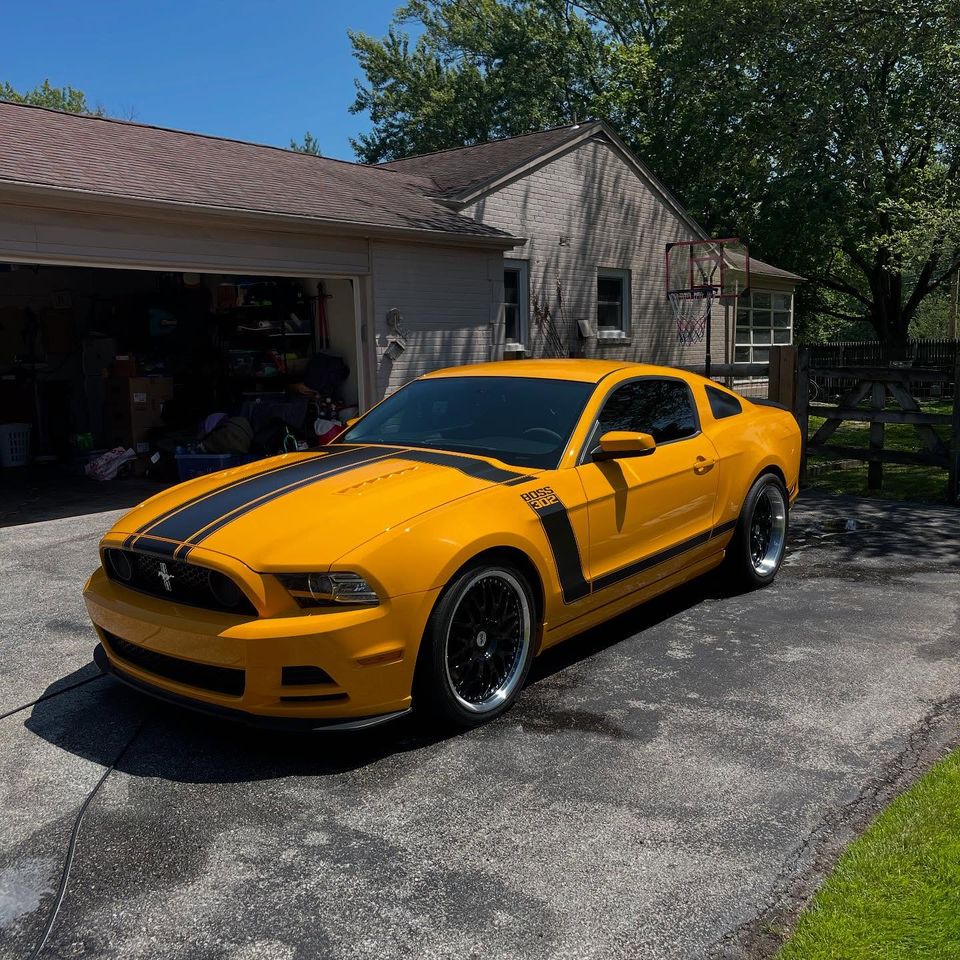 Yellow Ford Mustang Boss 302 with a fresh gloss finish after a mobile exterior cleaning in Wilmington Delaware