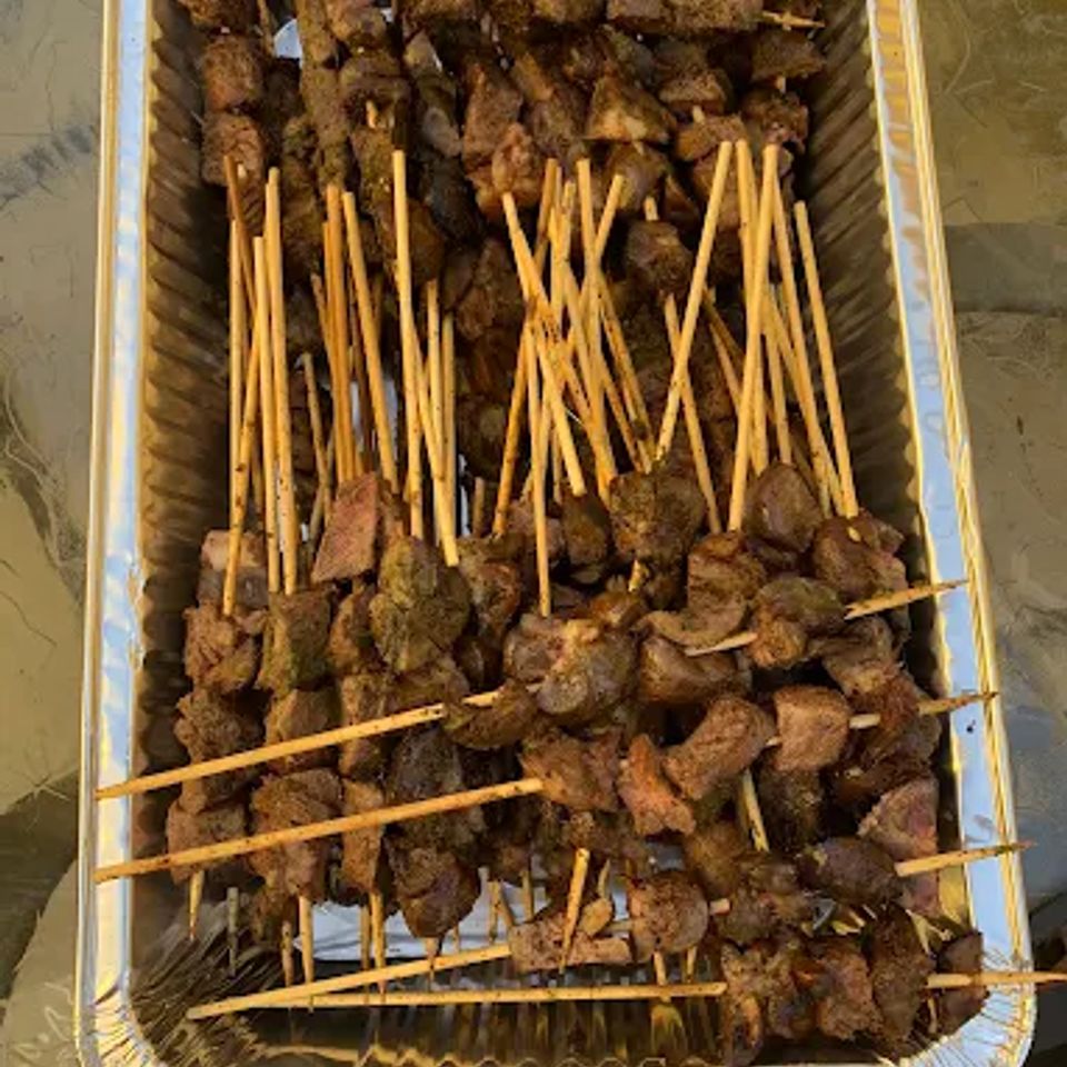 Catering tray of grilled beef skewers prepared for a Los Angeles event