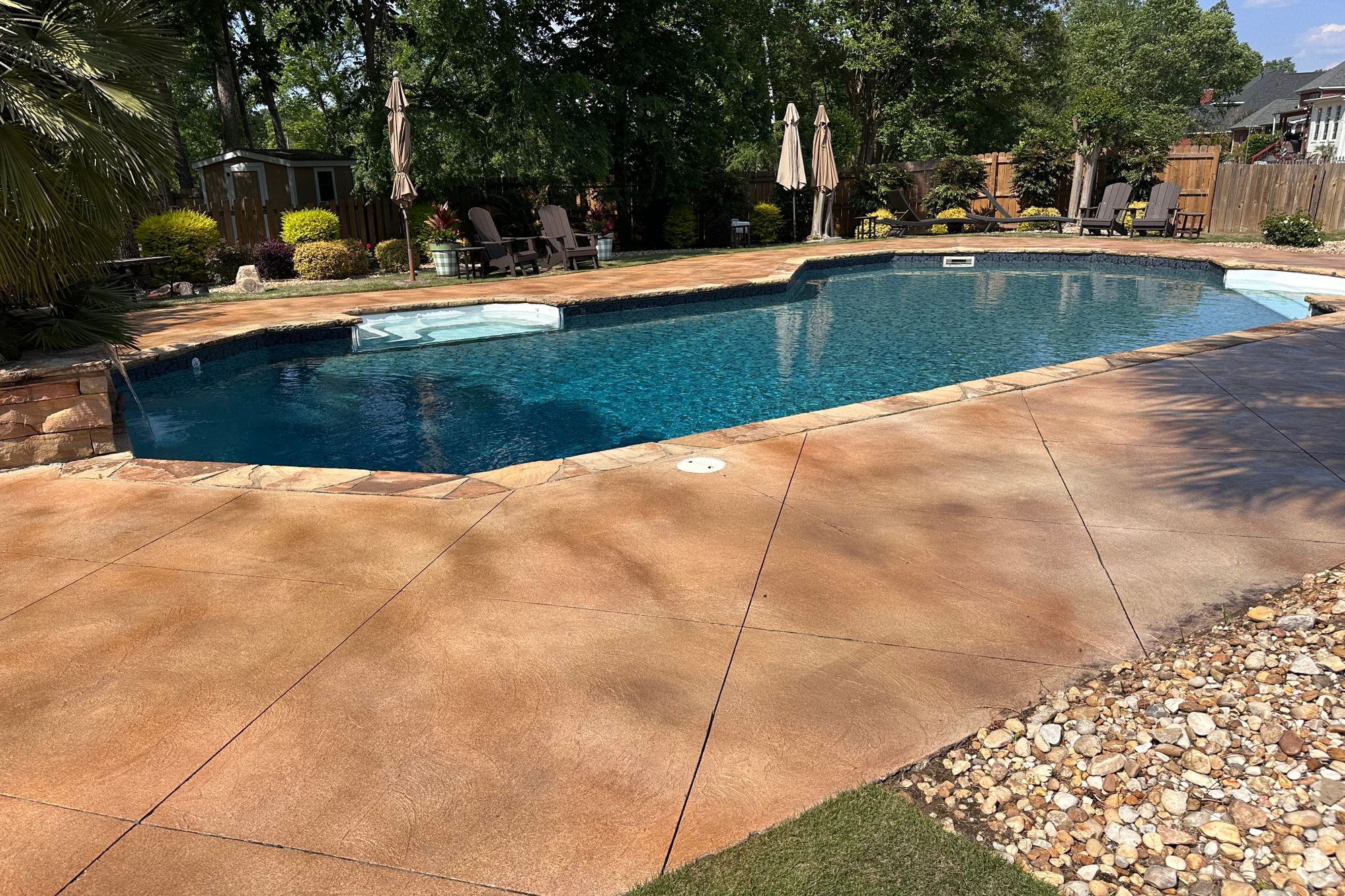 Evans GA pool deck with warm decorative concrete finish