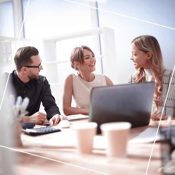Three people discussing business