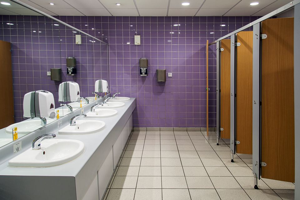Public restroom with stalls, sinks