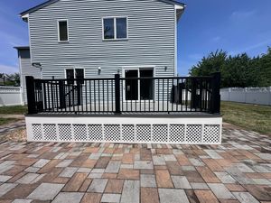 Custom deck railing installation by Best Builder Construction