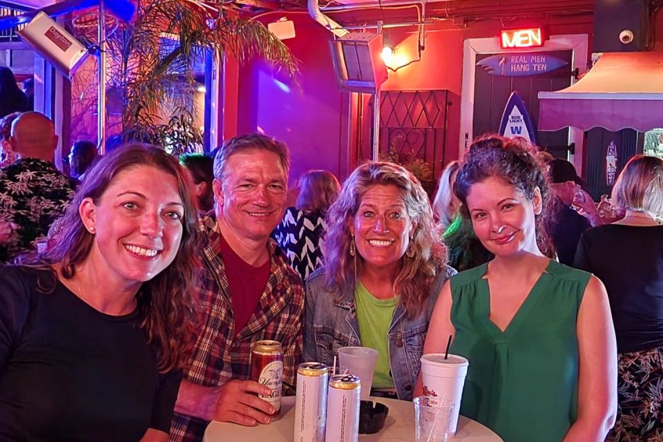 Four corporate event goers in the courtyard of the Beach on Bourbon.