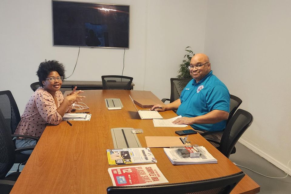 Woman (right) being consulted by Texas Veteran's Two-Step official