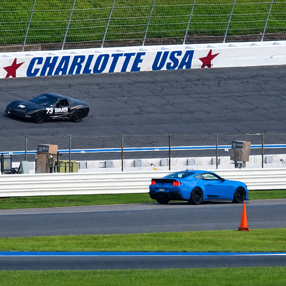 Client driving a race prepped Corvette track car with driver coaching at Road Atlanta