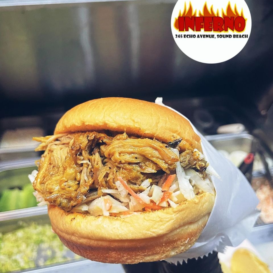 Stuffed burger with coleslaw and other toppings at Inferno The Restaurant in Sound Beach