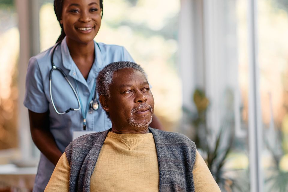 Pensive black senior in wheelchair and young nurse 2023 11 27 04 54 49 utc (1)