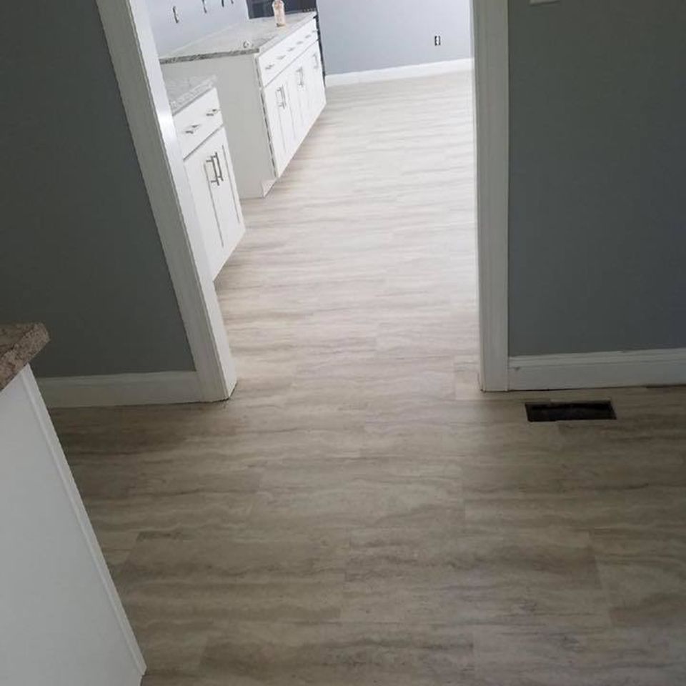 Residential vinyl flooring installed in open floor plan of Raleigh home.