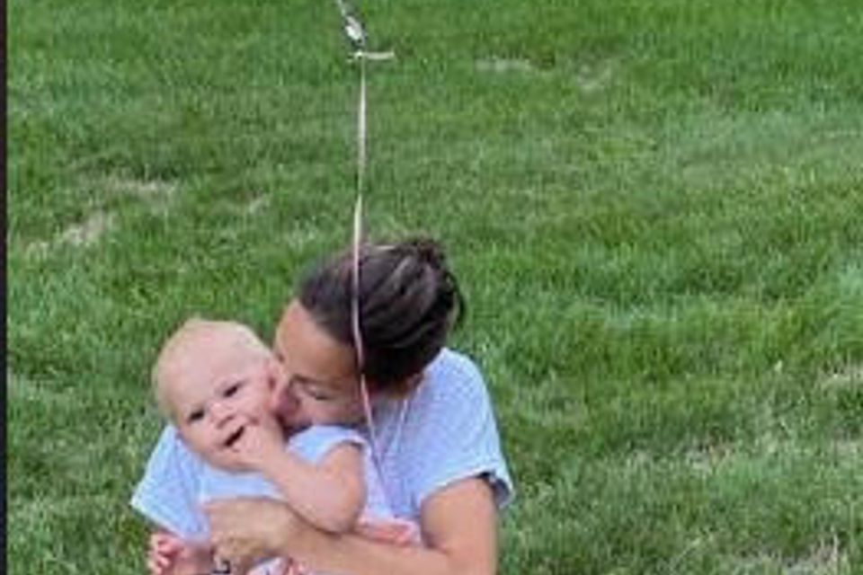 Adylaed mom and 1 year old balloon
