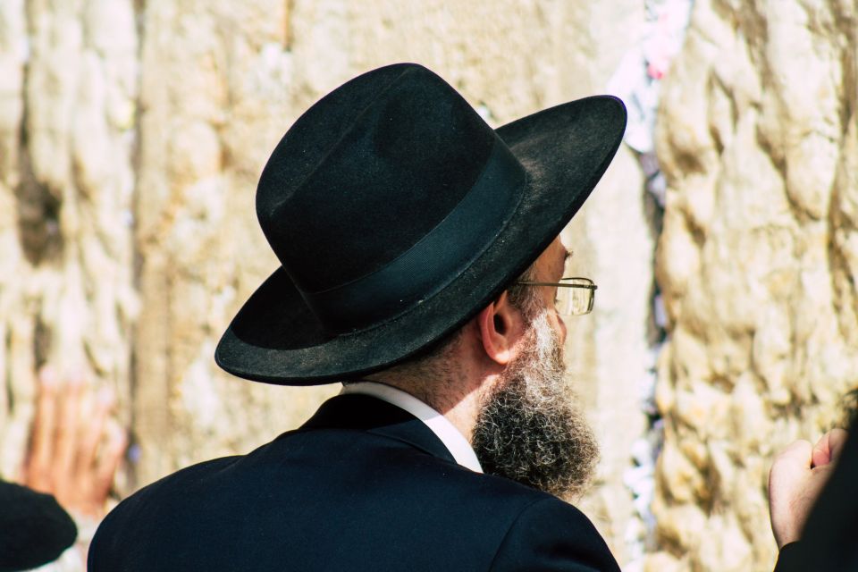 A person praying front the Western Wall at the Old city of Jerusalem