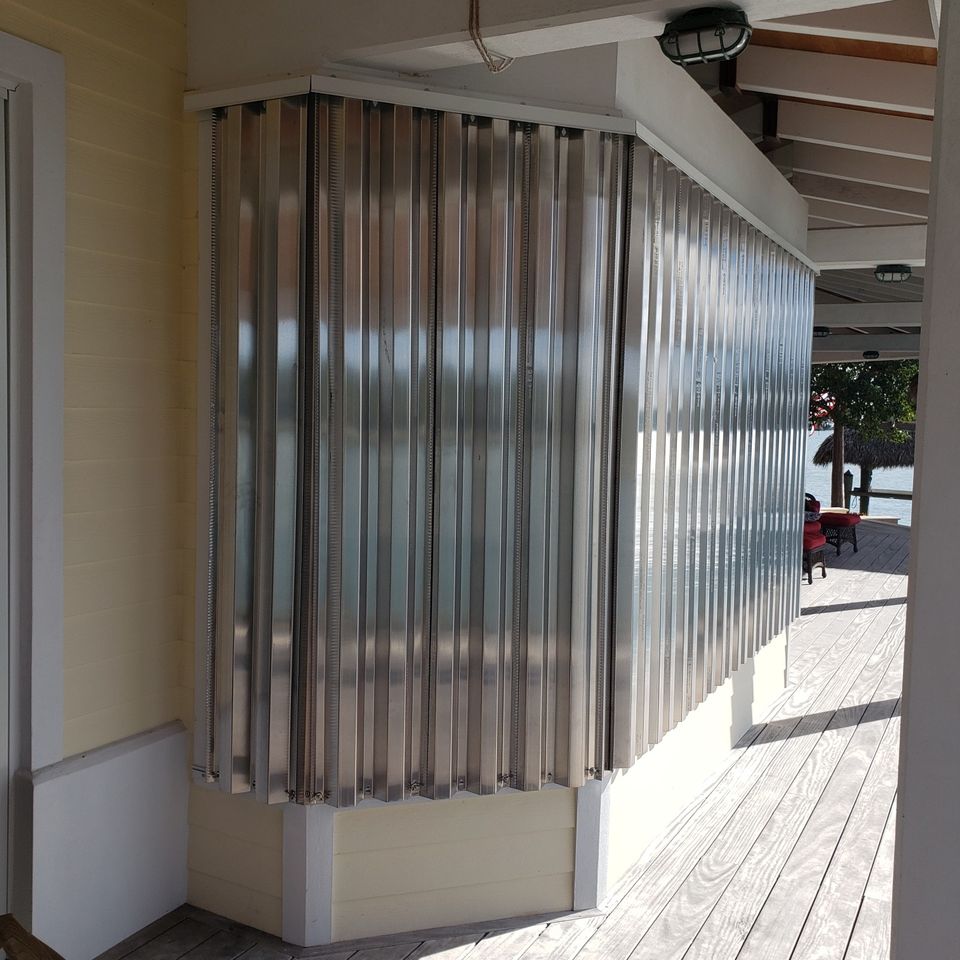 Storm panels butt glass opening