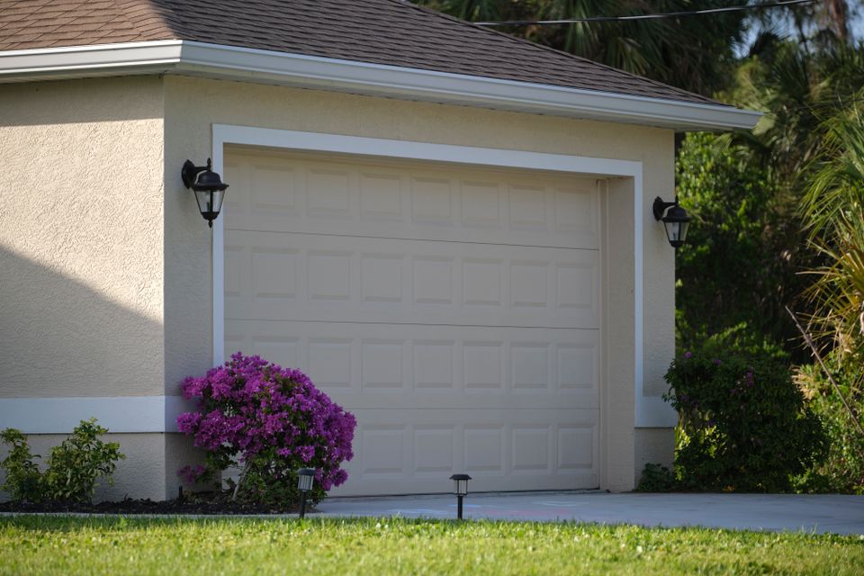 Wide garage double door and concrete driveway of n 2024 12 07 03 12 29 utc