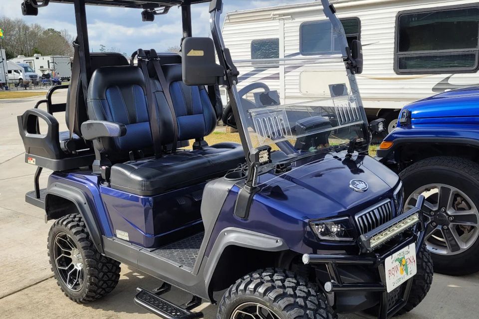 Electric blue golf cart in the parking lot