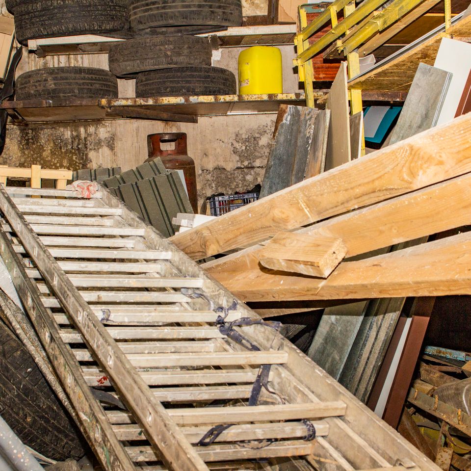 Trash in the garage, piled up different old things