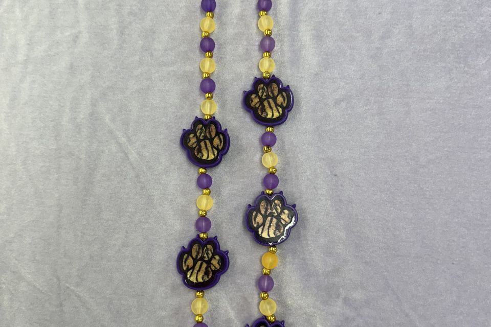 Purple and yellow beads with tiger paws