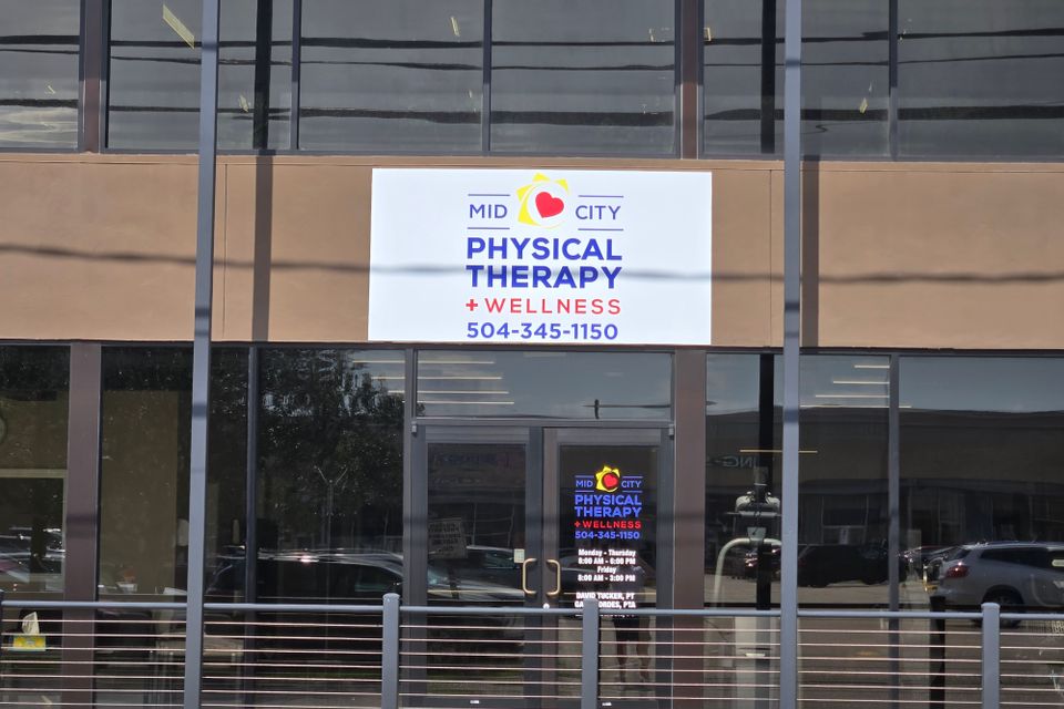 Exterior of Mid-City Physical Therapy Metairie clinic, showing entrance and building signage