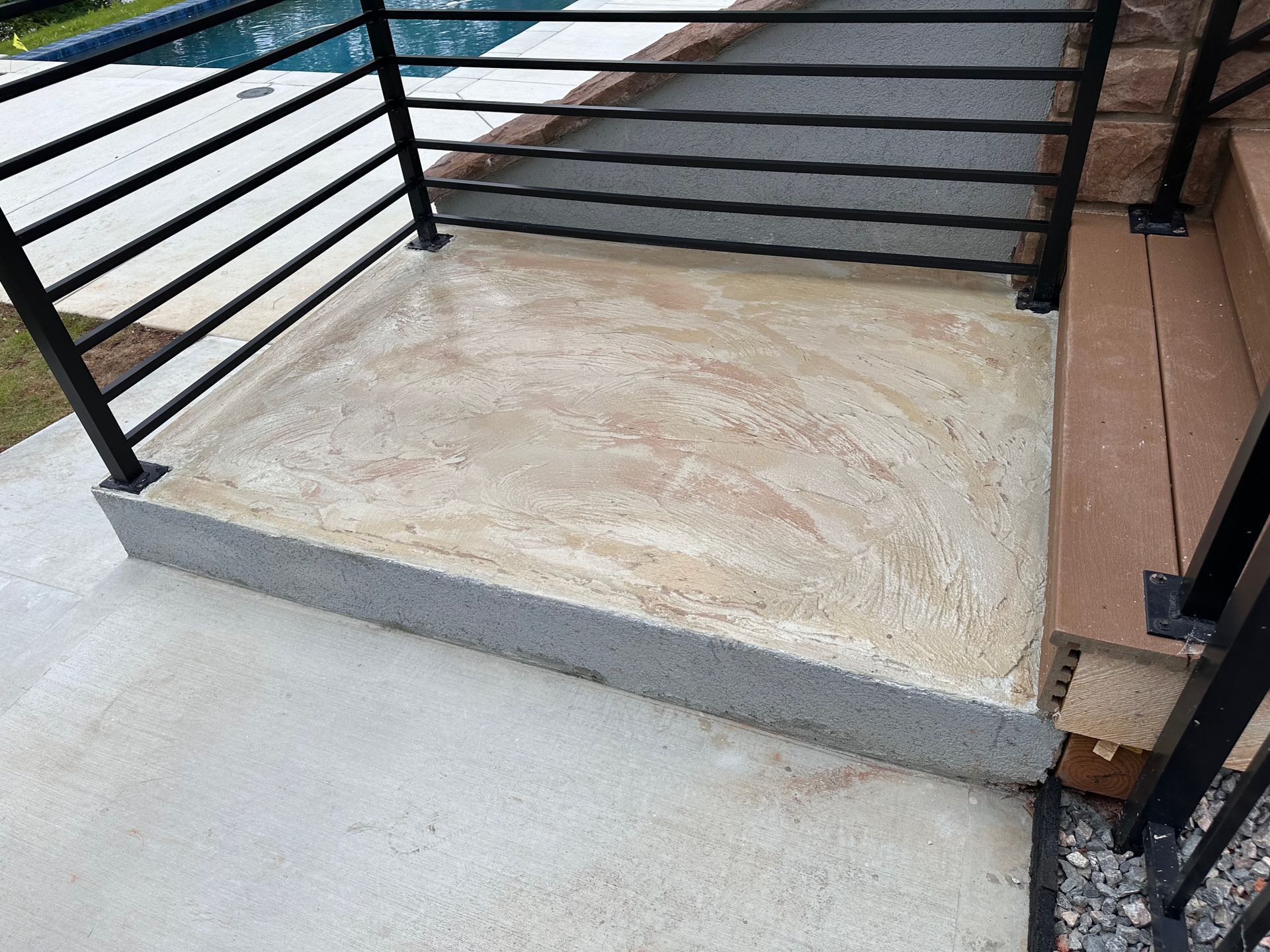 After photo of raised porch area with custom decorative concrete finish
