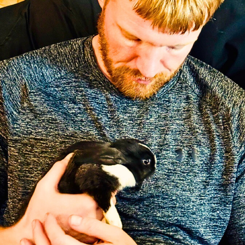 Cory holding baby bugs last easter