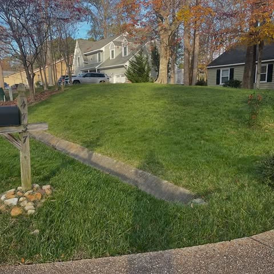 Wide shot of a clients grass after being cut, done by Get A Mow On Lawn Care LLC of Chesapeake VA