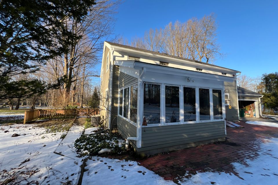 Original sunroom and exterior before Chagrin Falls home renovation