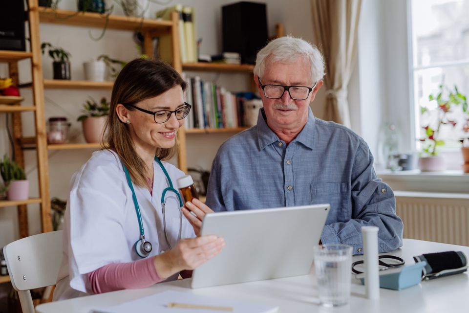 Healthcare worker or caregiver visiting senior man 2023 11 27 05 04 13 utc