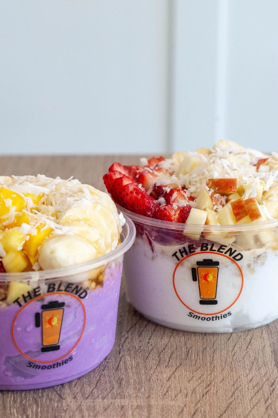 Acai bowls topped with strawberries, bananas, mango, apples, granola, and coconut flakes served at The Blend Smoothies in Winchester, CA.