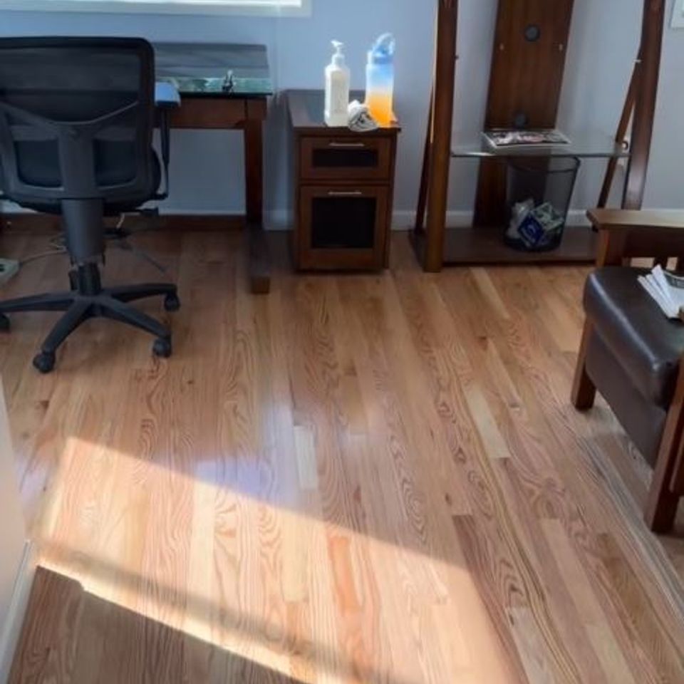 Refinished hardwood flooring in home office by general contractor in Suffolk County NY