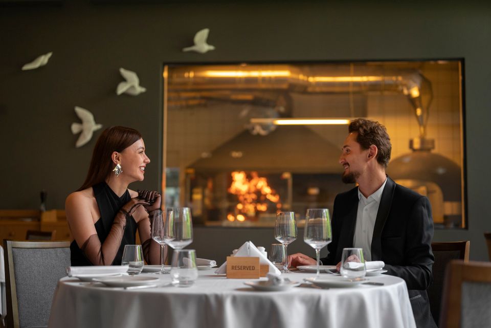 Medium shot couple having lunch luxury restaurant
