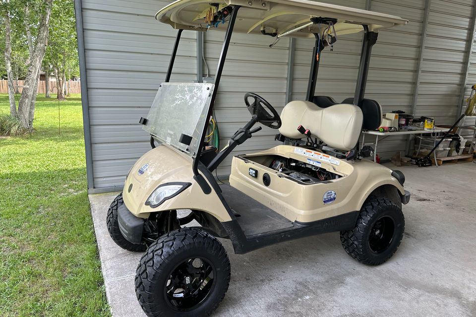 Tan golf cart with lithium conversion completed