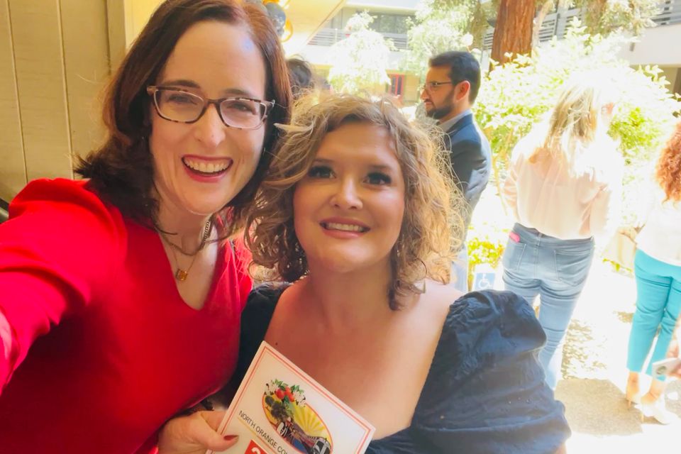Two women smiling