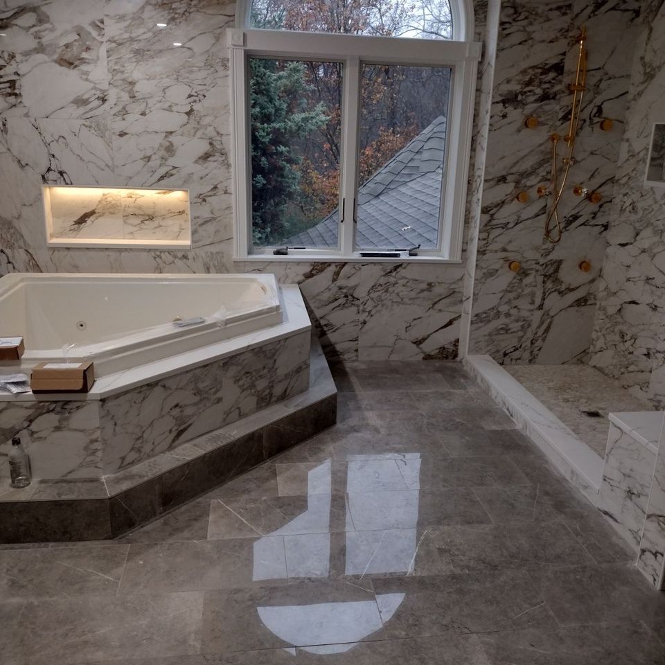 A gorgeous floor installation for a bathroom, done by Taurus Contracting Inc. of Suffolk County , NY