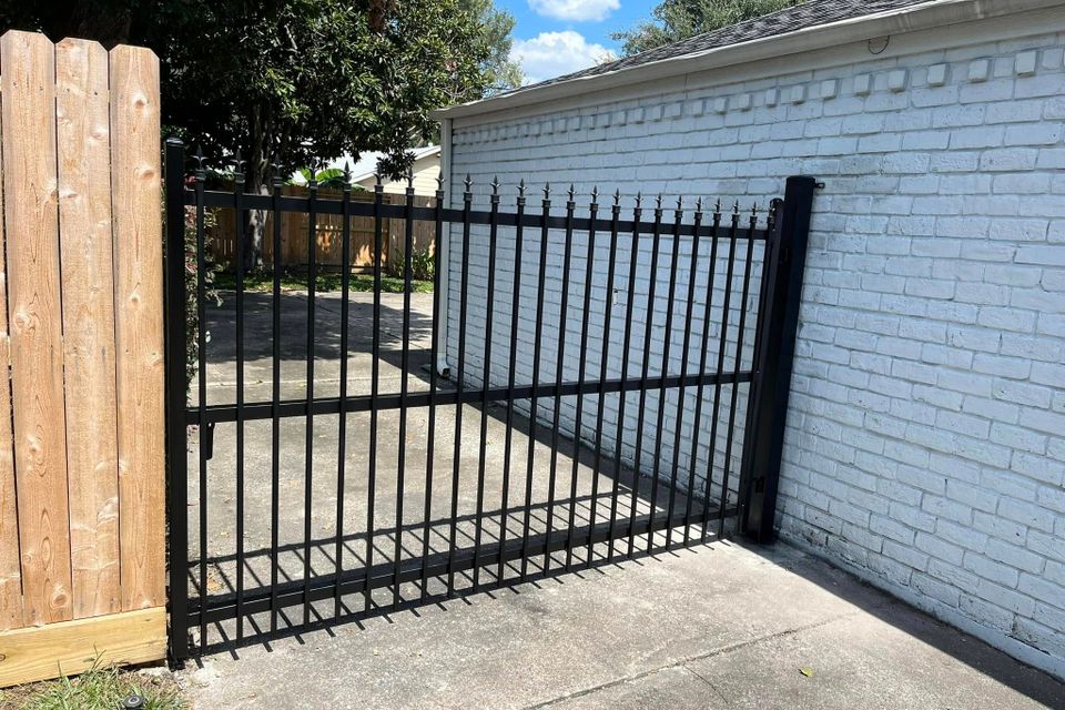 Black iron sliding gate designed by Marquez Welding Houston