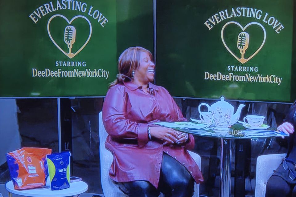 Deedee laughing during her interview with carmen on everlasting love show