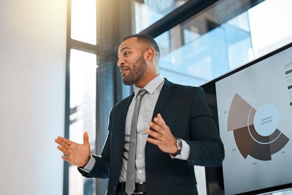 Business man explaining why branding and marketing is important 