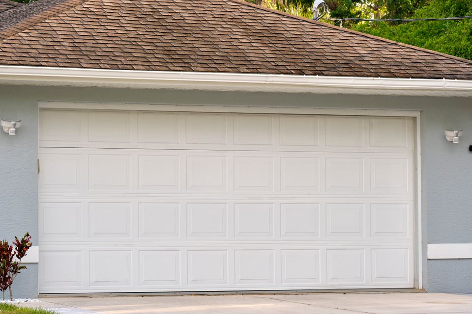 Wide garage double door and concrete driveway of n 2024 12 07 03 38 39 utc