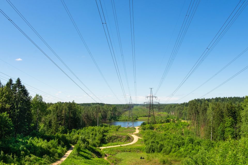 Depositphotos 385924582 l power line country landscape small lake