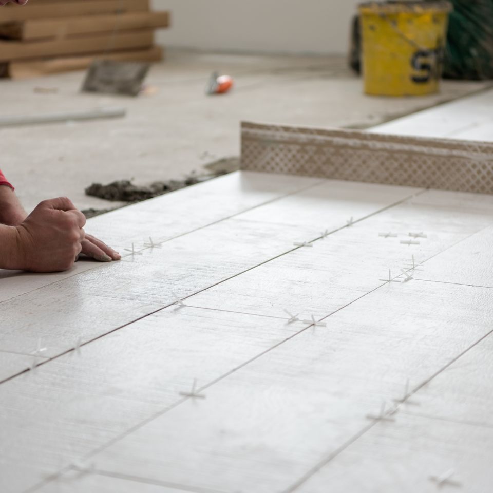 Vecteezy worker installing the ceramic wood effect tiles on the floor 11921326