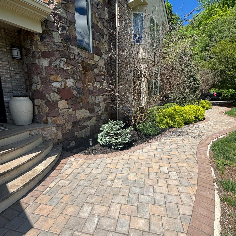 custom masonry walkway in front of home with custom masonry work