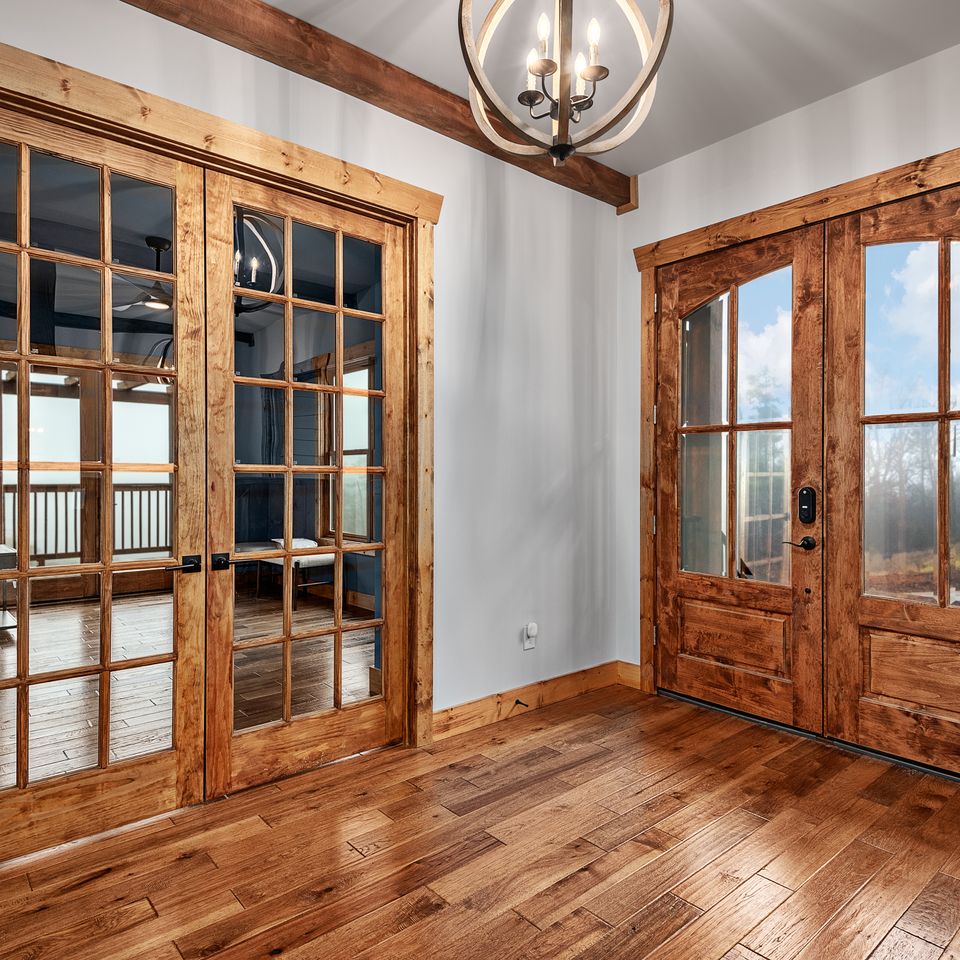 Entrance foyer   with french doors to the office