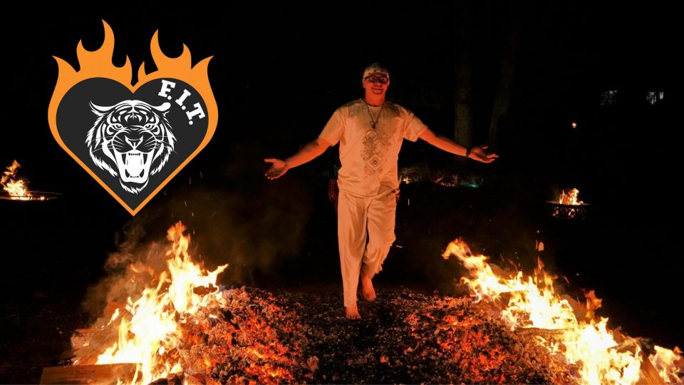 participant mid-stride across firewalk showing focus and determination. Fire Walker Instructor Training
