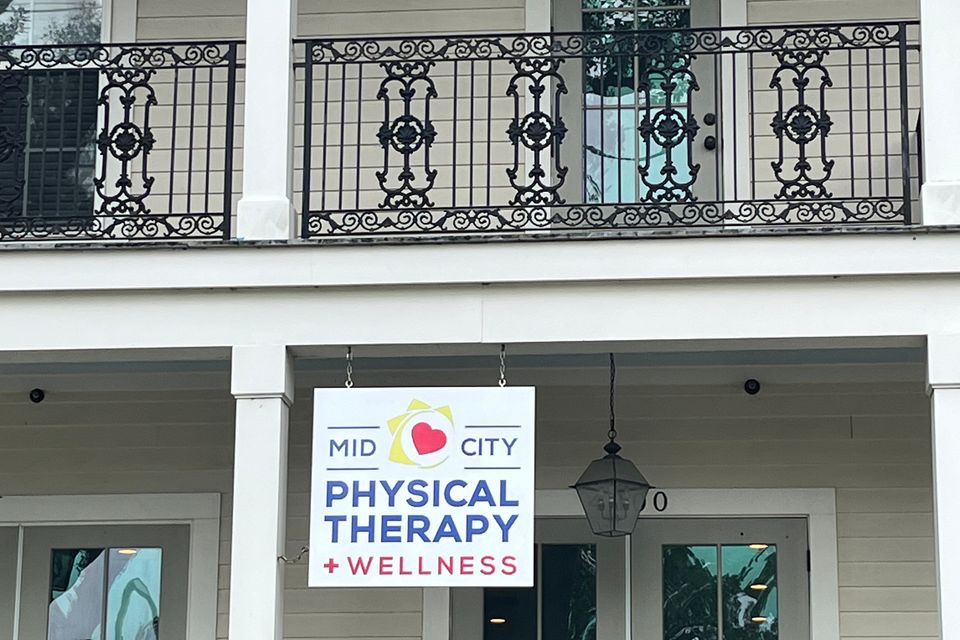 Front entrance of Mid-City Physical Therapy's New Orleans clinic with visible signage on Canal Street