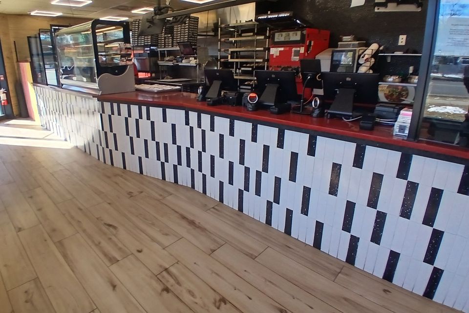 Custom-built pizza shop counter cabinetry designed by Ultimate Kitchens.