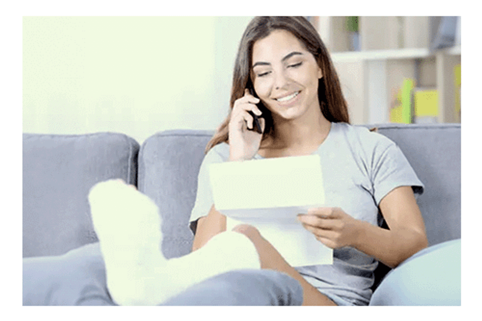 Girl in foot cast on phone