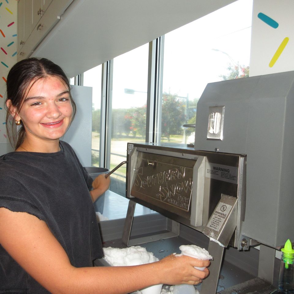 One of our hard working employees making a snowball