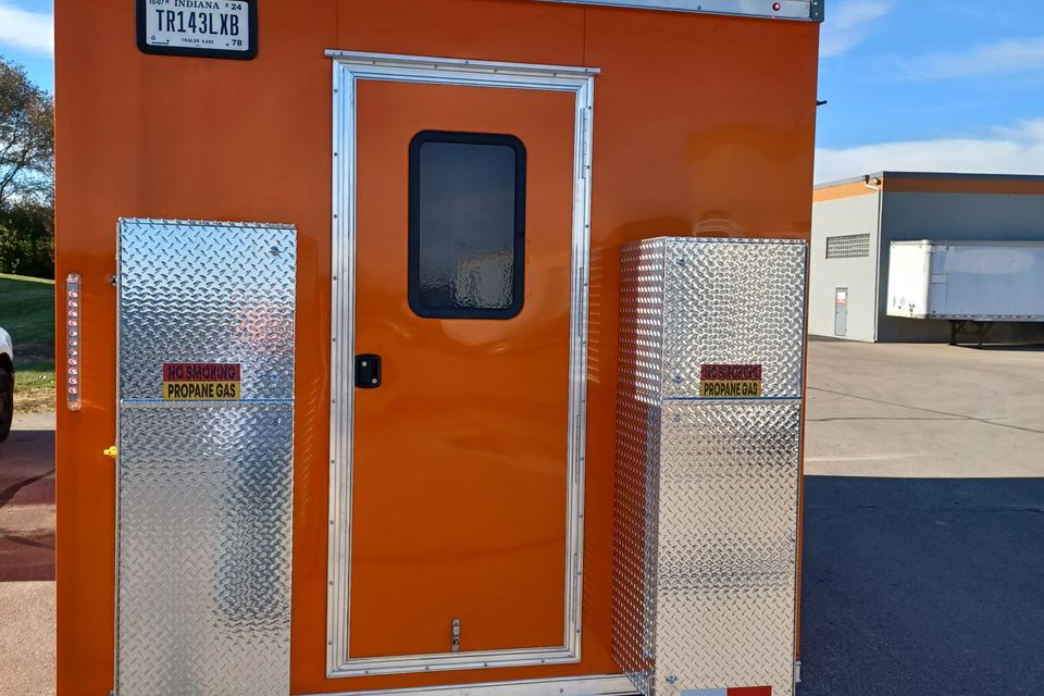 Orange trailer back tanks