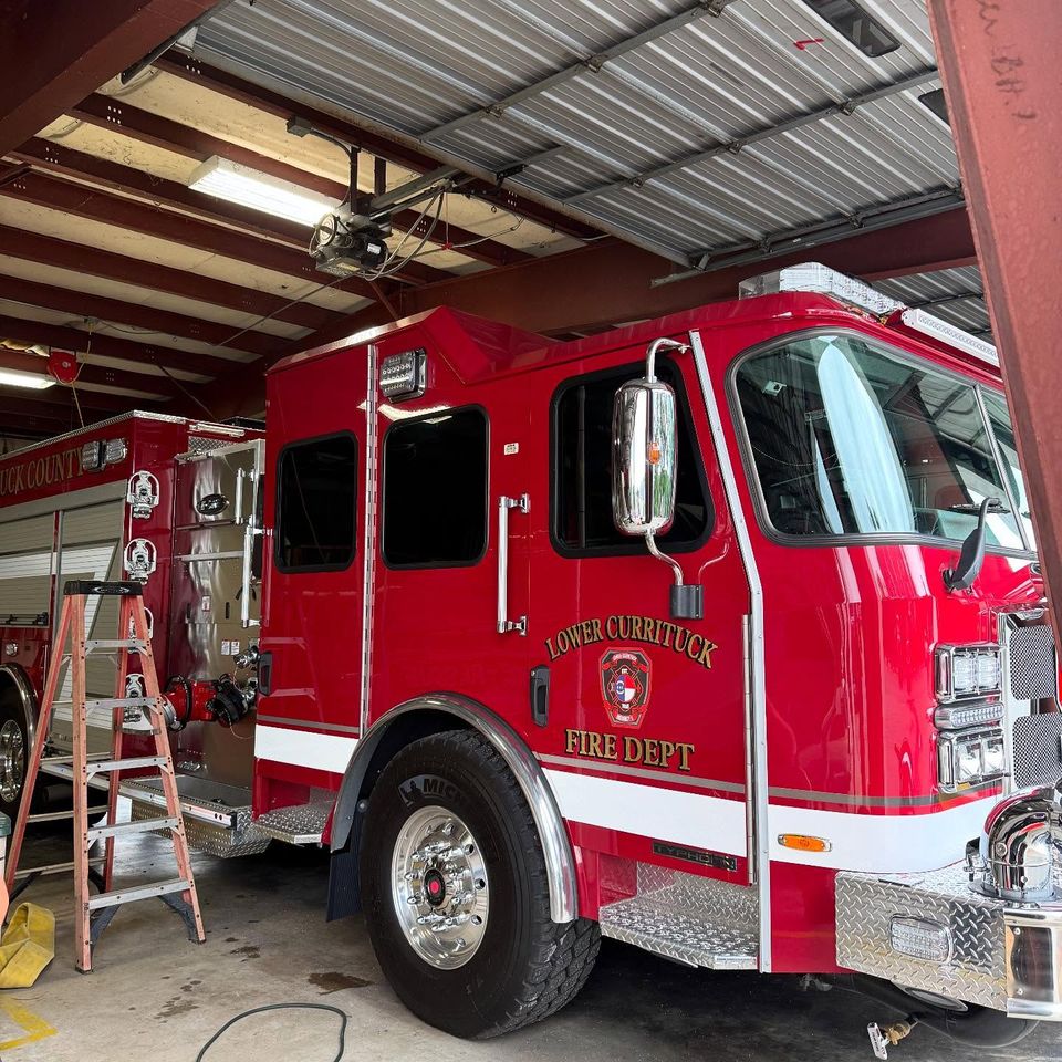 Lower Currituck Fire Department engine getting window tint installed in the shop bay