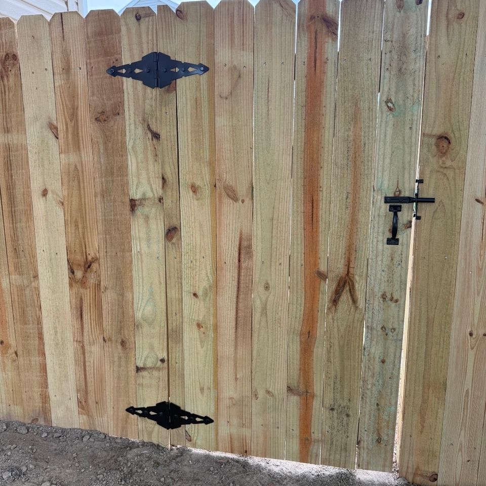 Wood privacy gate with black diamond hinges and latch hardware installed in Virginia Beach VA
