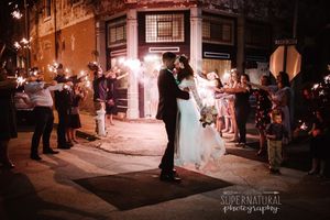 groom kissing bride at the coleman vault
